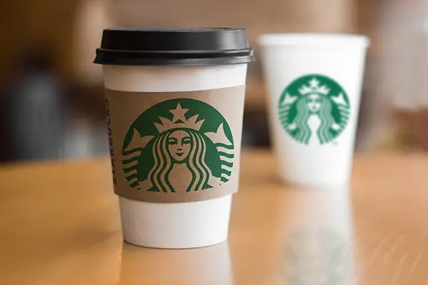 Starbucks cups on table