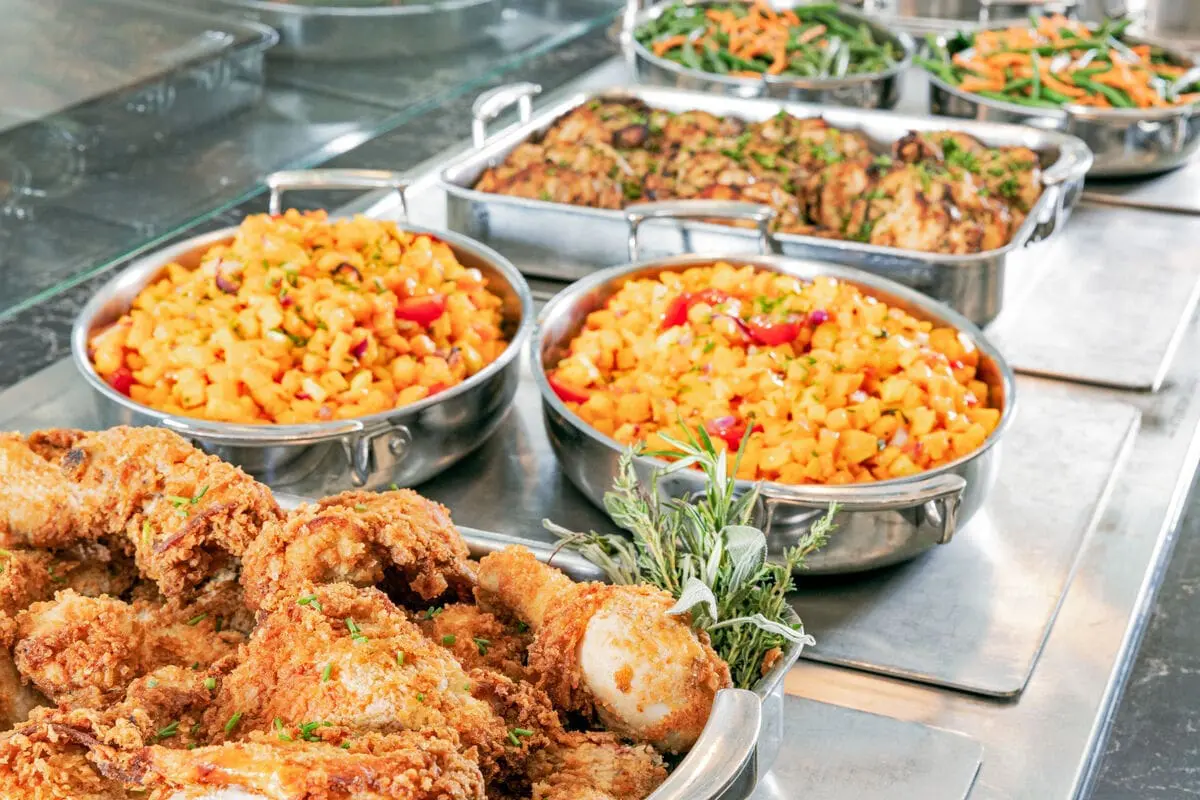 an assortment of food at a buffet line