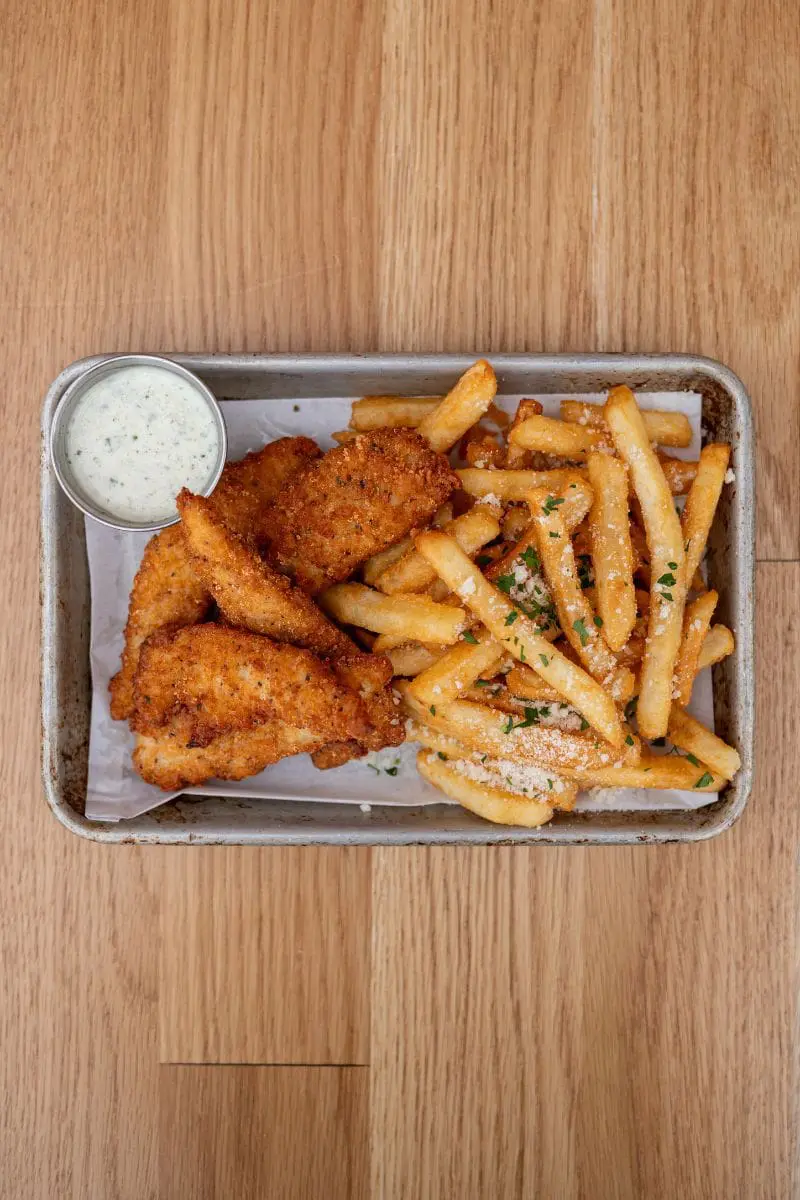 overhead view of chicken tenders and fries